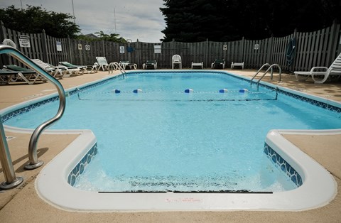 sparkling clean pool, crystal clear water, blue water, summer outdoor pool, at Regency Apartments in Bettendorf Iowa